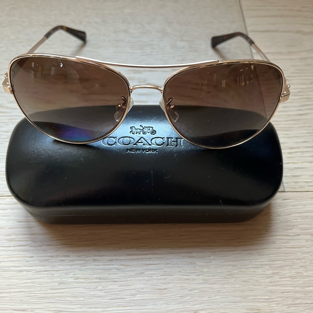 Coach aviator sunglasses.